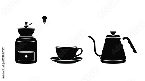 black and white image of coffee maker cup and saucer and kettle