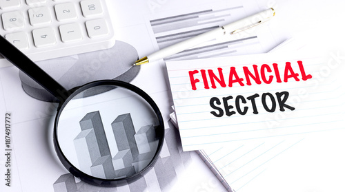 Tableau sur toile Financial sector phrase on lined index card with magnifying glass, pen, calculat
