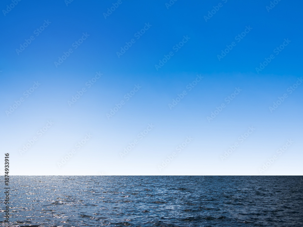 Fototapeta premium Sea ocean texture blue water nature with blue sky background, abstract shore clean calm natural summer for tourism travel in holidays, island deep surface.