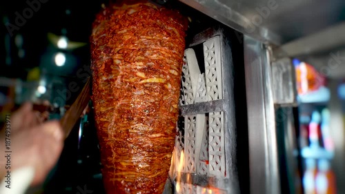 An iconic dish of Mexican cuisine, trompo al pastor—also known as trompo de pastor—is a Mexican-style barbecue inspired by kebab, slow-roasted on a vertical trompo, where a skilled taquero carves