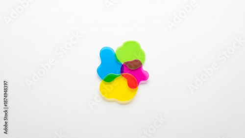Colorful puzzle pieces fit together in a butterfly shape on white