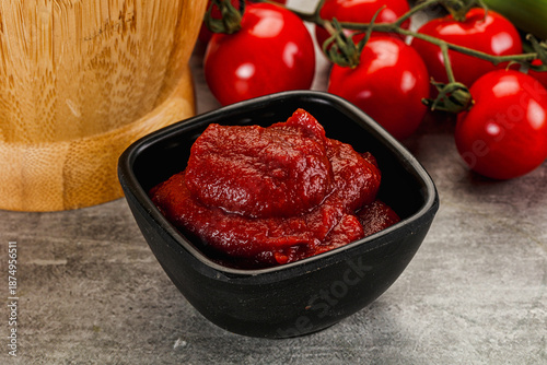 Red tomato paste in the bowl