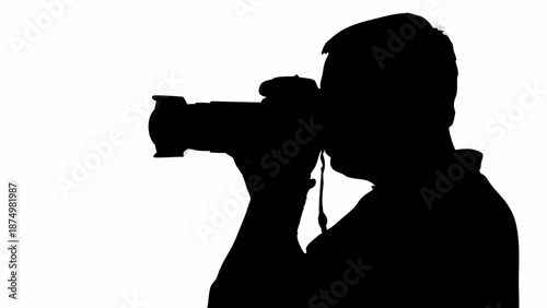 Photographer in silhouette taking professional photos