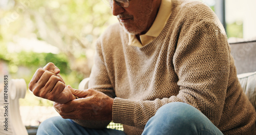 Fotografía Hands, sofa and wrist pain in home, injury and senior man in lounge with joint inflammation