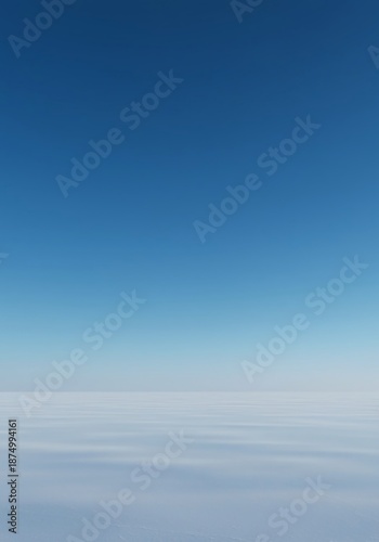 A vast, seamless expanse where the distant blue environment meets the open sky, creating an endless, wide visual backdrop, copy space, daylight, tranquil