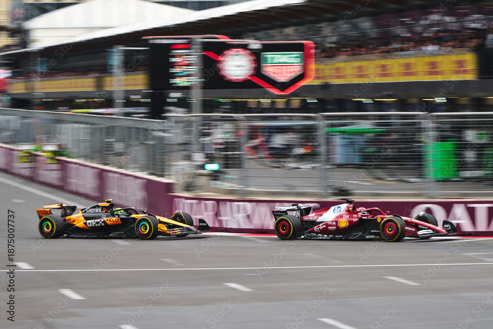 Fototapeta premium BAKU, AZERBAIJAN - SEPTEMBER 21, 2025: Max Verstappen speeds along the Baku City Circuit in his Oracle Red Bull Racing RB21 during the Azerbaijan Grand Prix