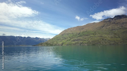 Wallpaper Mural Turquoise lake and mountain shoreline from boat under blue sky Torontodigital.ca