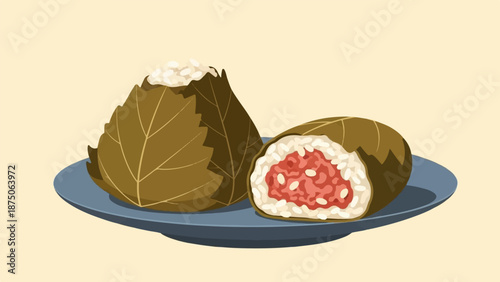 Illustration of two leaf-wrapped rice balls on a plate, one cut to show the filling
