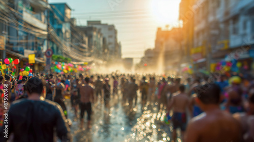 Wallpaper Mural Blurred perspective of crowded Songkran water festival with people splashing water in Bangkok street during summer sunset Torontodigital.ca