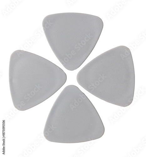 Four guitar picks are shown on a white background