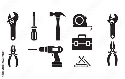 Assortment of construction and repair tools in silhouette: wrench, screwdriver, hammer, drill, pliers