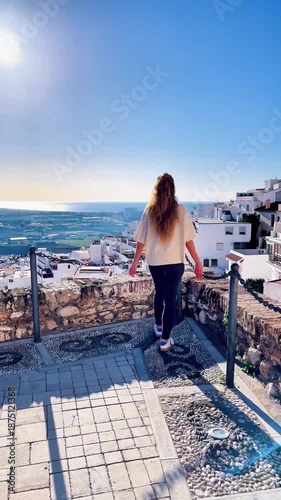 woman visiting city in Andalusia with famous white houses, Granada province, Salobreña. Traveling in Spain