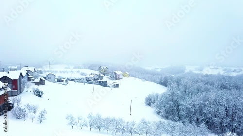 Snowy Hillside Village and Forest in Winter, Bosnia and Herzegovina