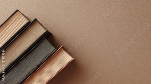 Elegant Stack of Vintage Books on a Warm Textured Background