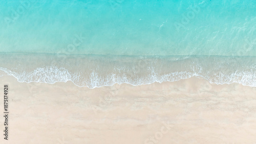 Fotografie Aerial View of Turquoise Shoreline in a tropical Beach waves and Ocean