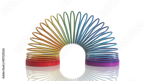 A vibrant rainbow-colored slinky toy curved in a beautiful arc on a reflective white surface