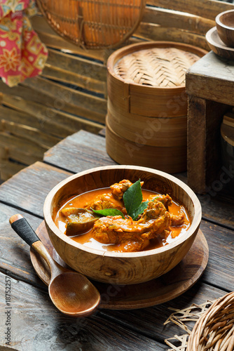 Kari Ayam is a traditional Southeast Asian chicken curry cooked with aromatic spices and coconut milk delivering rich savory flavors commonly enjoyed as a comforting home cooked meal with rice or brea