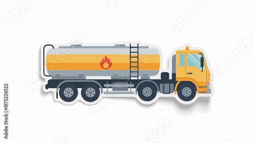 A yellow tanker truck with a graphic of flames on its side