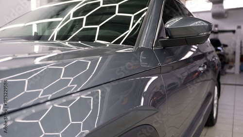 Quadro su tela Black car body repair process in professional workshop