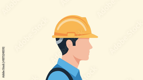 A profile of a person wearing a yellow hard hat and blue shirt