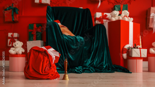 Photography Santa Claus's chair draped in velvet, surrounded by Christmas gifts and teddy be