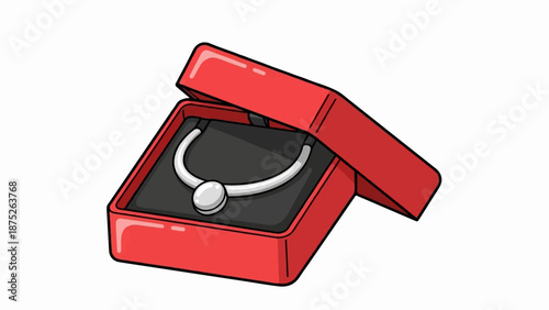 A silver necklace with a round pearl is displayed in an open red jewelry box on a black velvet cushion