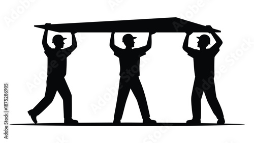 Three workers in silhouette carrying a large object