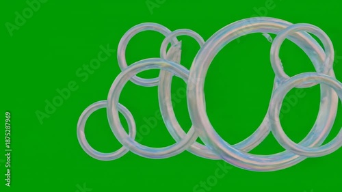 Two shiny gold rings forming an infinity symbol reflect glowing fiber optic cables against a green abstract background