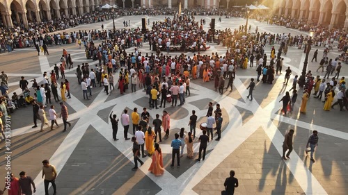 Crowded public square with people walking