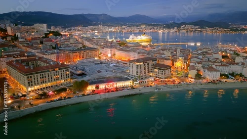 sunset over france coastal town with boats, scenic view of ancient castle and busy marina at dusk. Ajaccio