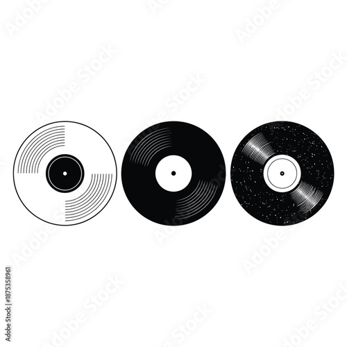 three vinyl records in different stages of production line