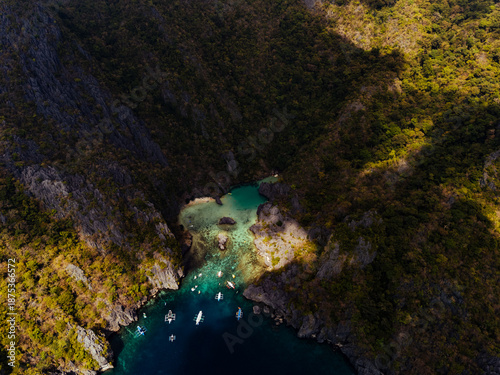 Wallpaper Mural Crystal-clear turquoise water surrounded by dramatic limestone cliffs in the Big and Small Lagoons of Palawan Torontodigital.ca