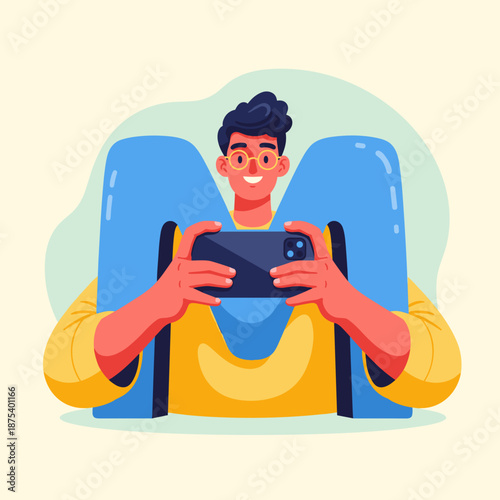 Young man playing mobile game with a large letter M behind him