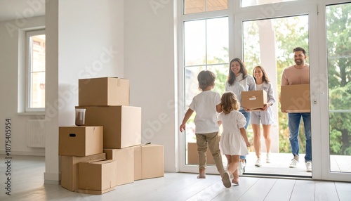 Happy family with children moving into a new house, parents carrying cardboard boxes through the front door.