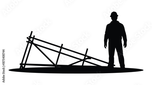 Construction worker standing beside fallen scaffolding