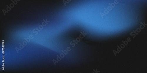 A blue and black abstract background with a grainy texture appears blurry