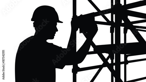 Construction worker building scaffolding with drill