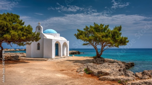 Picturesque White Chapel with Blue Dome by the Turquoise Sea in Cyprus