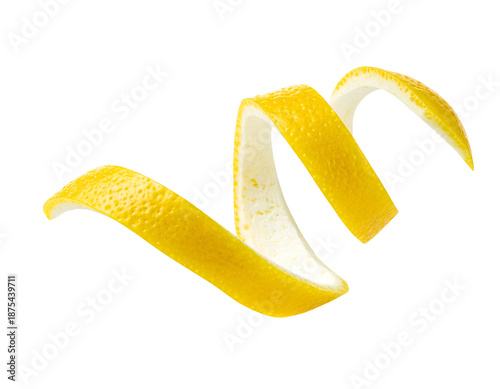 Curled lemon peel ribbon twist with bright yellow citrus rind and white pith, garnish for cocktails and desserts on isolated background