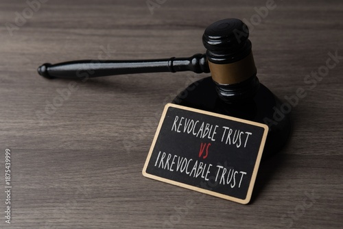 Obraz na plátně Judge gavel with a sign showing revocable trust versus irrevocable trust