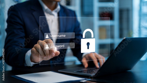 Businessman logging in securely to laptop with username and password protection