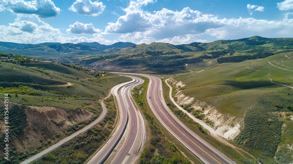 Fototapeta premium Winding Highway Through Mountainous Landscape, Aerial Perspective