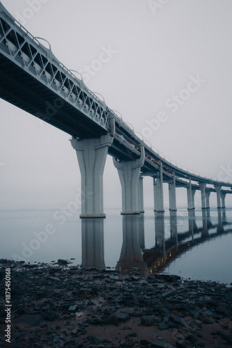 Surreal overpass over the water, reflection, minimalistic