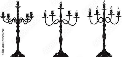 Vintage black candelabra silhouettes with ornate designs and lit candles on white background