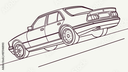 Sleek vintage sedan driving uphill on a solitary road