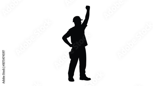 Confident construction worker celebrating success with raised fist