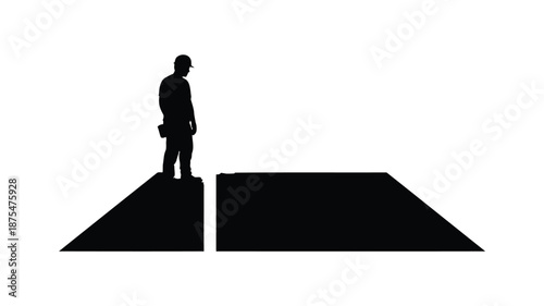 Man standing on edge of cliff looking out at vast empty space