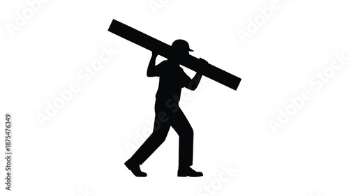 Man carrying large object on shoulder in silhouette