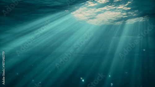 Underwater Sunbeams Light Rays Penetrating Deep Blue Ocean Water Surface.