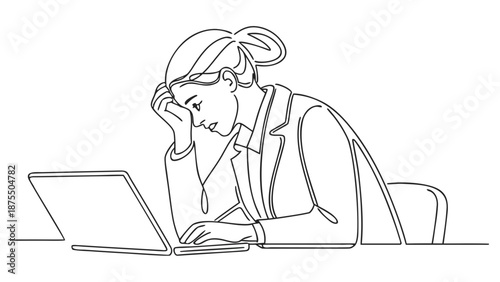Tired businesswoman overwhelmed by work, resting her head on her hand while looking at her laptop.